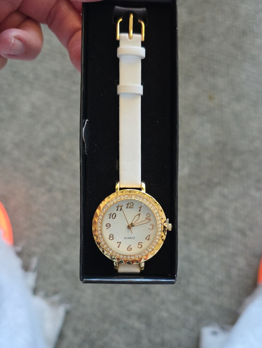 Avon Gold-Tone Crystal Bezel Watch with White Strap